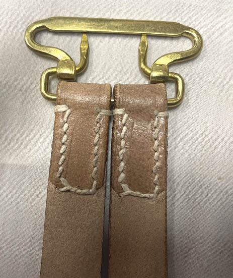 Reverse of suspender ends, showing hand stitched cross over.
